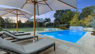 Backshot of two Umbrellas on the pool