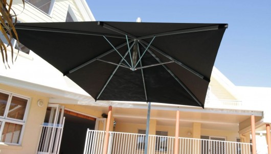 Cantilever Umbrella by a pool
