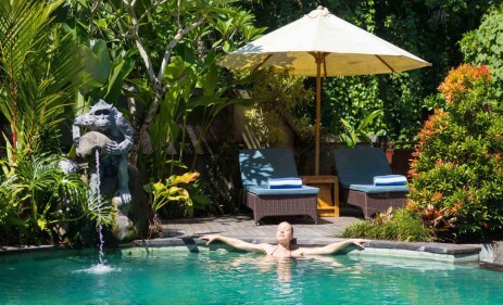 Girl relaxing inside Resort's pool