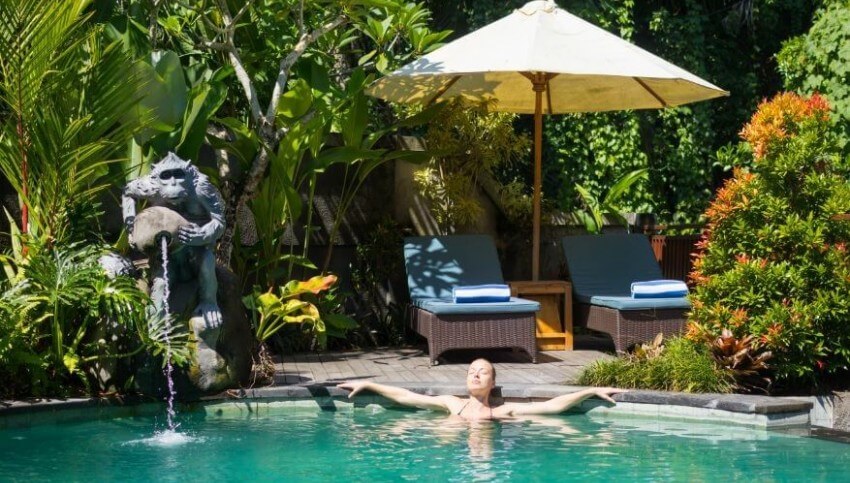 Girl relaxing inside Resort's pool