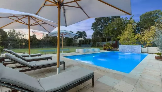 Backshot of two Umbrellas on the pool