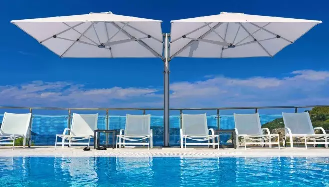 Front shot of two Umbrellas on the pool
