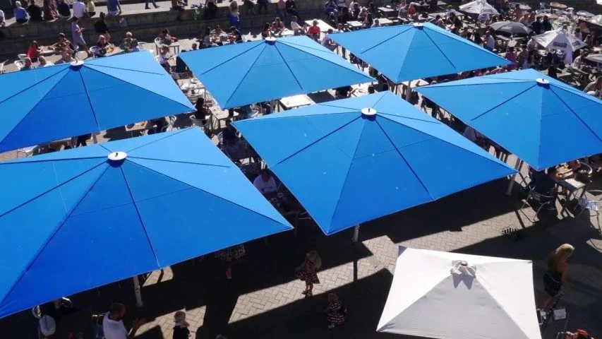 Six large umbrellas in blue